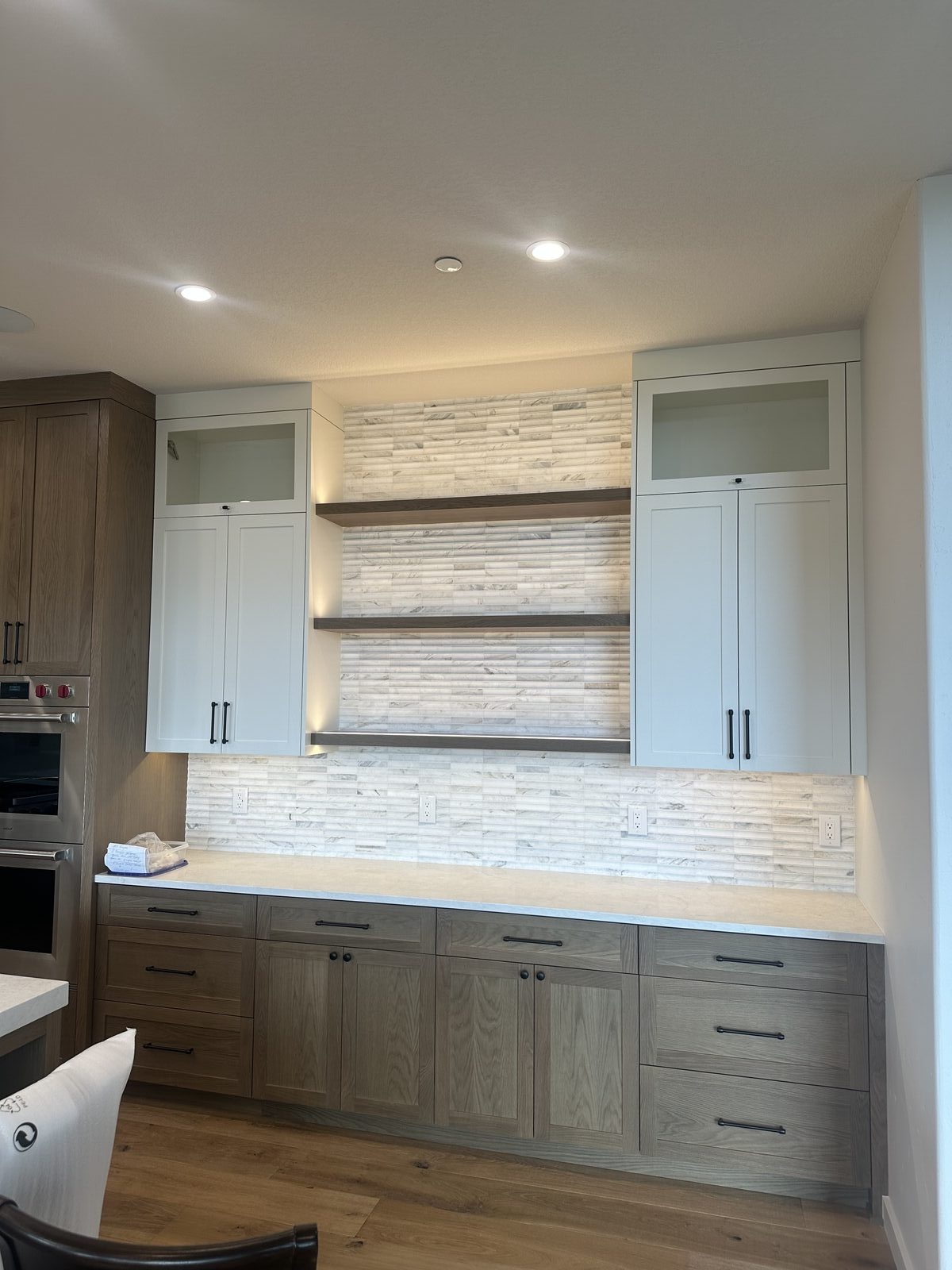 Kitchen backsplash with decorative accent tile strip, installed by BM Pro Construction